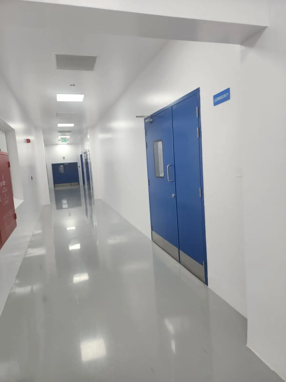 Cleanroom corridor with blue doors
