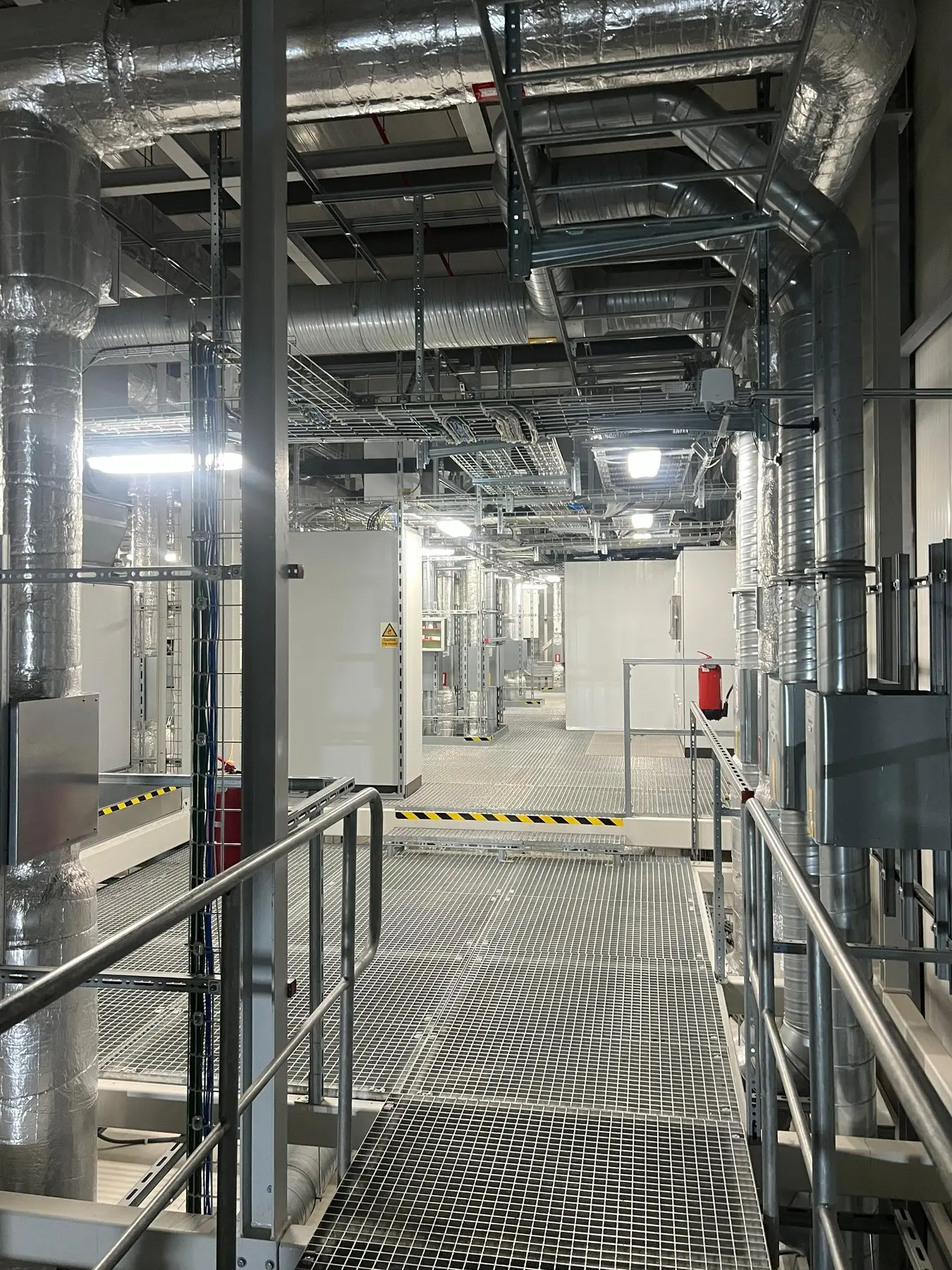 Coordinated overhead services above a plant-room walkway